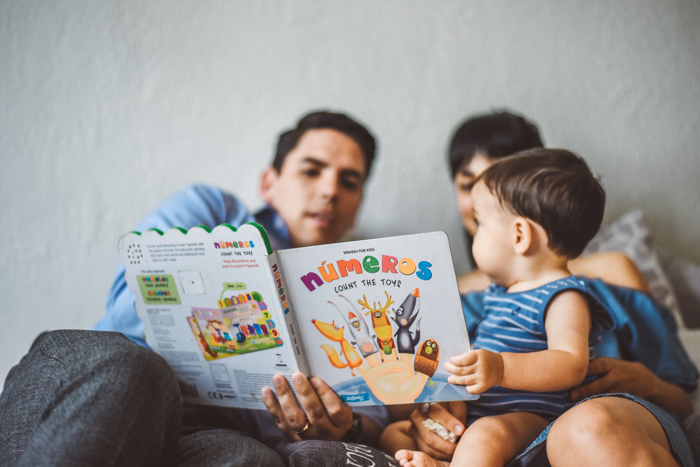 Parents Reading Their Child a Story 